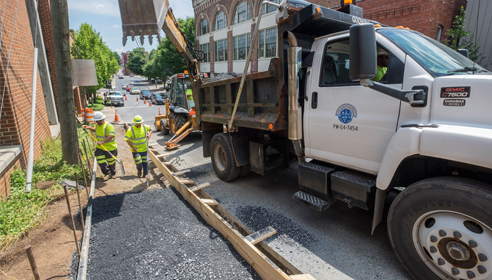 laying sidewalk public works